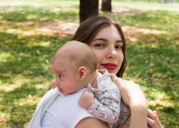 Why do babies throw up after drinking milk?