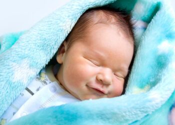 Why do babies smile in their sleep?