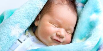 Why do babies smile in their sleep?