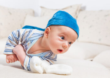 When will a baby start to roll over?