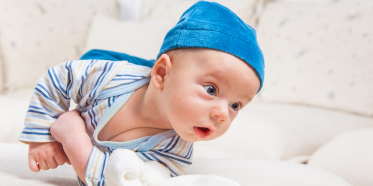 When will a baby start to roll over?
