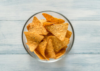 What do the black spots on the corn chips signify?